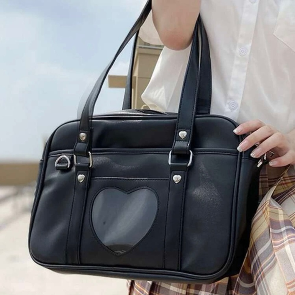 Like new! Black bag with a heart 💟 Smoke free house. Only worn one time!